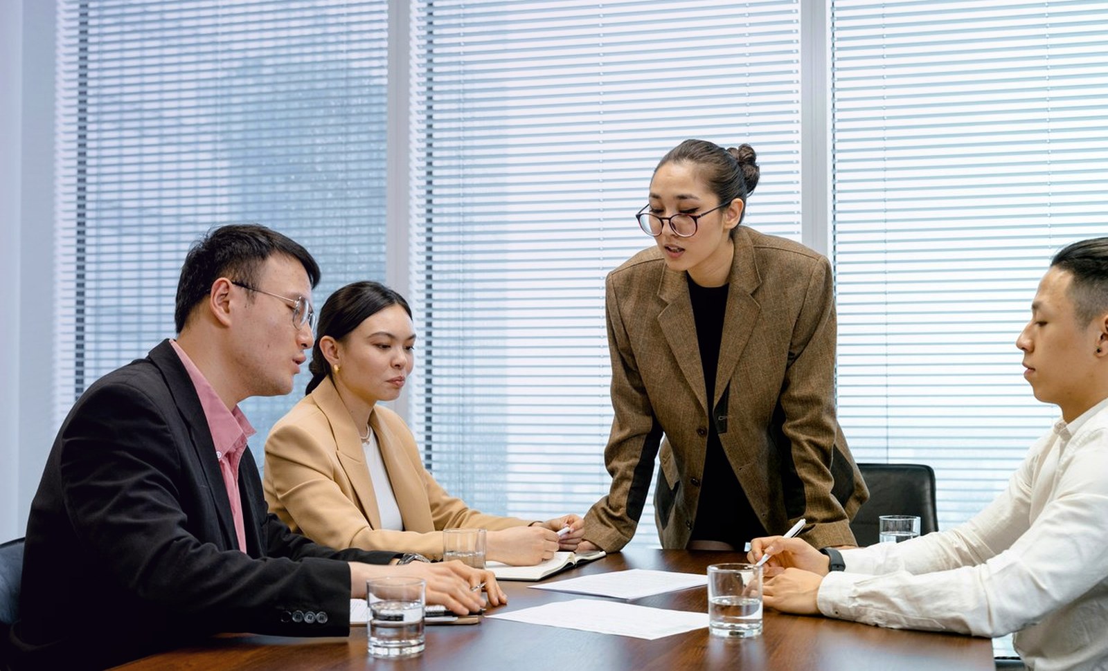 Professional team reviewing meeting plans